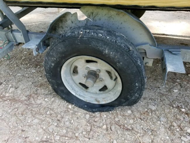 FlatDamagedFender shredded trailer tire